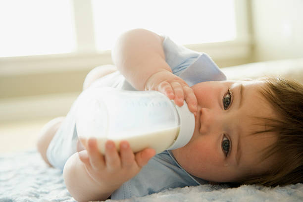aby boy drinking milk from milk bottle