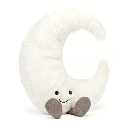 Plush toy shaped like a crescent moon with a smiling face on a white background