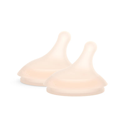 Two beige silicone teething rings on a white background