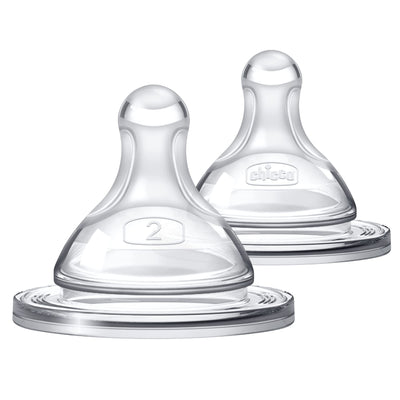 Two clear baby bottle nipples on a white background
