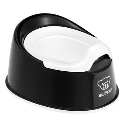 Black and white potty chair with BABYBJöRN logo on a white background