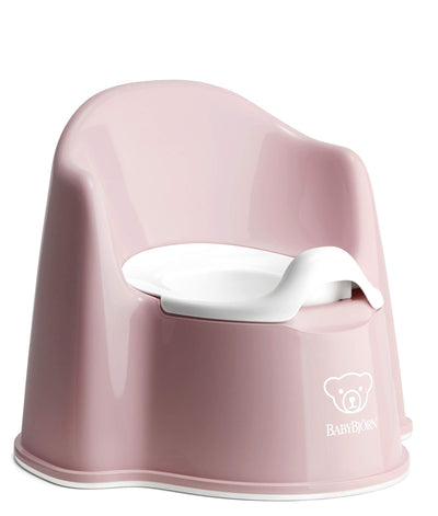 Pink children's potty chair with white seat on a white background