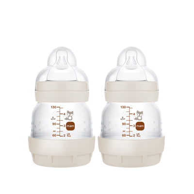 Two baby bottles with measurement markings on a white background