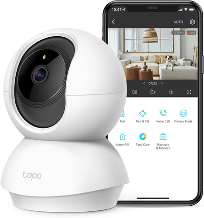 White TP-Link smart camera with smartphone displaying app interface on a white background
