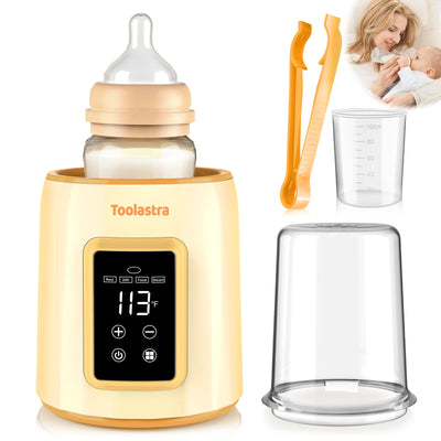 Baby bottle warmer with digital display, baby bottle, spoon, and measuring cup on a white background.