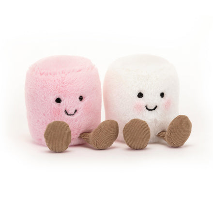 Two plush marshmallow toys, one pink and one white, on a white background