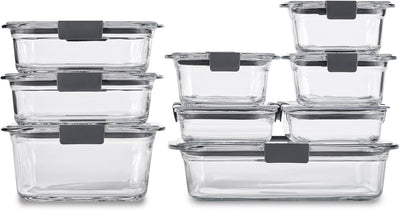 Set of clear glass food storage containers with gray lids on a white background