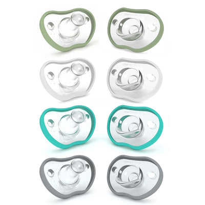 Set of baby pacifiers with green, gray, and teal borders on a white background