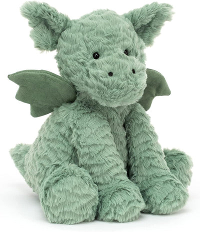 Green plush dragon toy on a white background