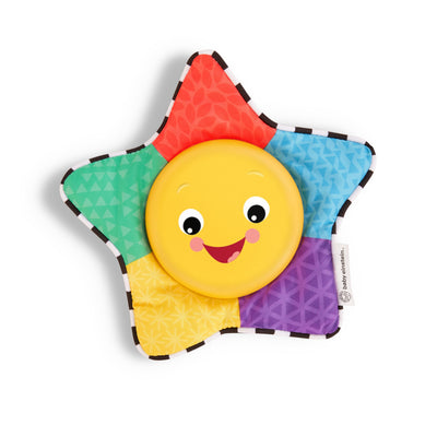 Colorful star-shaped toy with a smiling face on a white background