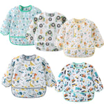 Five children's bibs with various patterns on a white background