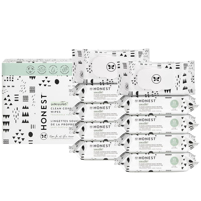 Multiple packages of the honest brand wipes on a white background