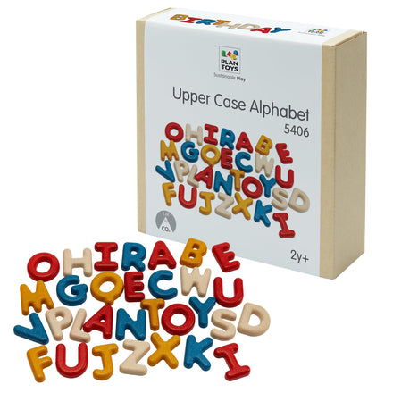 Colorful wooden alphabet letters with a Plan Toys packaging box on a white background