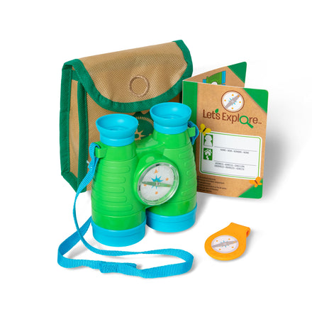 Green and blue binoculars with a compass, carrying case, and activity book on a white background.