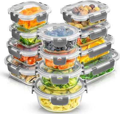 Set of glass food storage containers with lids filled with various foods on a white background